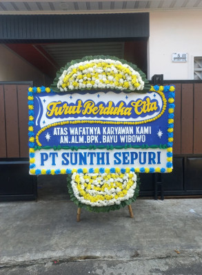 Papan Bunga Duka di Pangkul